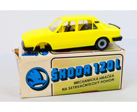 Kovad of Czech - Skoda. A boxed 1/20th scale plastic friction drive model of a Skoda 120L, Yellow in red and housed in the or