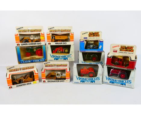 Ertl - A boxed collection of diecast model tractors and construction vehicles in various scales from Ertl. Lot includes Ertl 