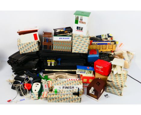 Scalextric - A group of boxed and unboxed vintage Scalextric trackside buildings, accessories and track. Lot includes A/212 S