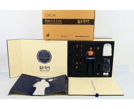 Bruce Lee - Hot Toys. A boxed, DX04 Bruce Lee, 'Enter The Dragon' 1/6th scale figure appearing Mint in Box with Mint box and 