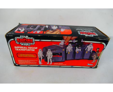 Star Wars - Kenner - A boxed Star Wars TESB Imperial Troop Transporter. The transporter has some signs of play, appearing to 