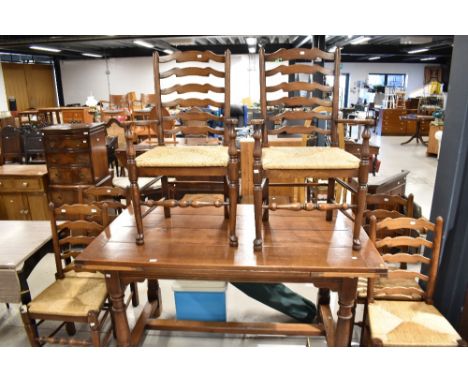 A set of six (four plus two) traditional ladder back dining chairs having rush seats