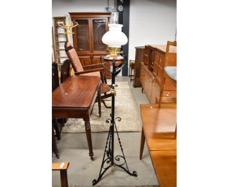 A Victorian cast standard oil lamp having copper and brass fittings and opaque glass shade
