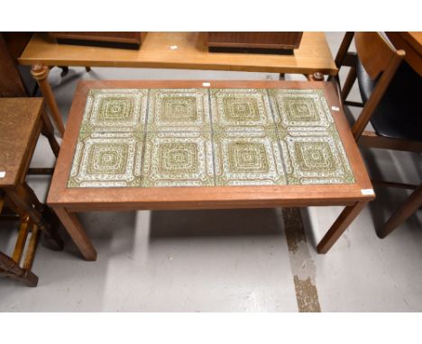 A vintage teak and textured tile top coffee table