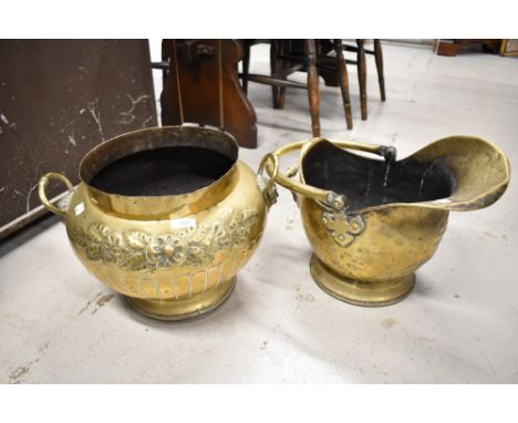 A traditional brass coal helmet and similar planter.
Planter 28cm high x 36cm wide
Coal Bucket 44cm x 28cm x 30cm