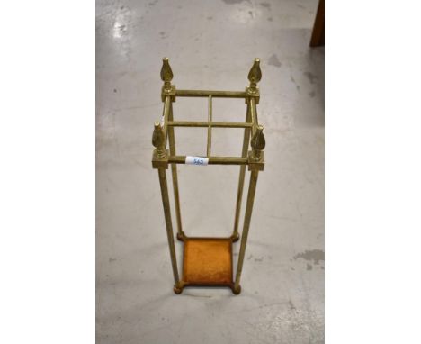 A vintage brass stick or umbrella stand