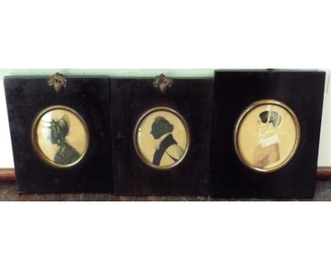 Two early 19th century silhouette profile portrait miniatures, both of oval form, one showing a lady in ribboned bonnet and t