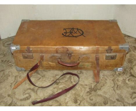 A vintage stitched tan leather suitcase with metal fittings together with a further smaller fibre suitcase housed within(2)