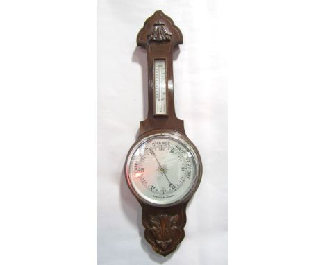 Mid-20th century aneroid barometer/thermometer, with silvered back plates and carved oak detail, 80cm high