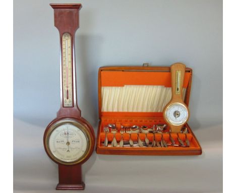 Teak cased canteen of vintage cutlery together with two barometers (3)