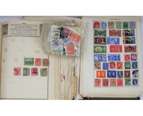 Two stamp albums containing British and worldwide stamps, mid 20th-century onwards, together with a small quantity of loose s