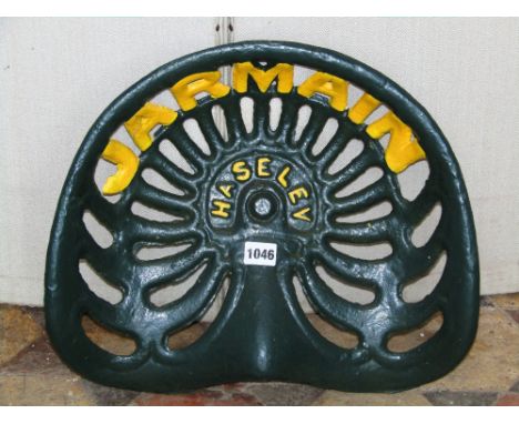 A vintage cast iron Haseley Jarmain tractor seat with pierced detail