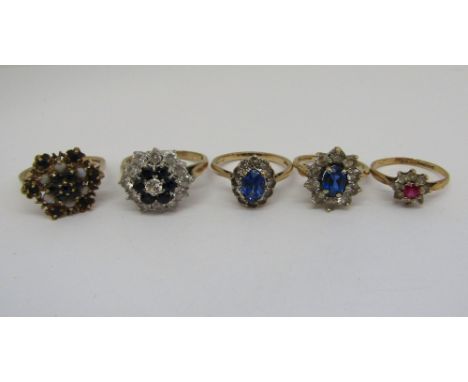 Five 9ct cluster dress rings comprising a sapphire and white stone example, sapphire and opal cluster example and three paste