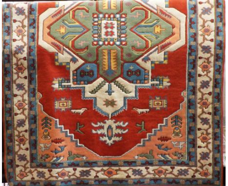 Good Turkish carpet, with colourful medallion decoration on a red ground, 290 x 185cm 