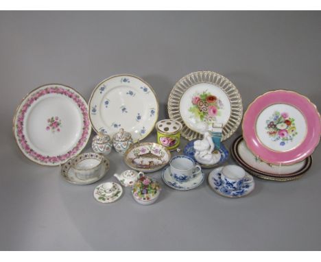 An 18th century Worcester blue and white cup and saucer with painted floral sprays and with crescent marks to base, together 