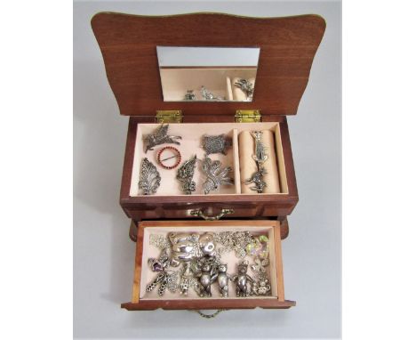Collection of silver jewellery comprising seven marcasite set brooches, an articulated brooch and two similar pendants modell