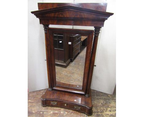 A substantial early 19th century mahogany dressing mirror, the box base of convex form enclosing a frieze drawer, the turned 