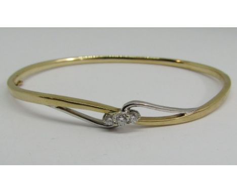 9ct bi-colour hinged bangle set with three diamonds, 10g