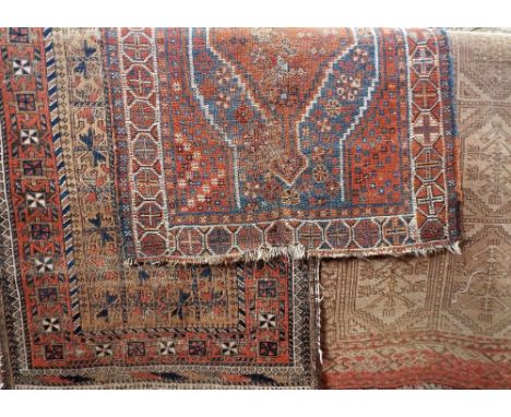 Three antique Persian rugs to include a Bokhara, 200 x 110cm, a Quashqai, 110 x 90cm and a further Quashqai type runner, 260 