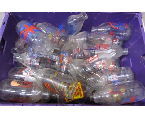 A collection of 55 vintage (mainly Unigate) moulded glass milk bottles, all with various labels advertising Kellogg's Cornfla