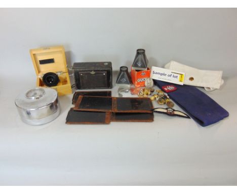 French Watchmans clock, Charvet, with outer leather case, a small collection of vintage camera equipment, military buttons, e