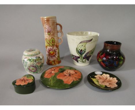 A collection of Moorcroft ceramics including a vase in the anemone pattern with impressed marks to base, 13 cm tall approx, a