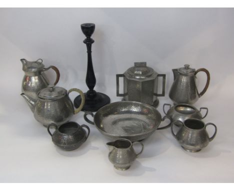 A collection of various planished pewter teawares to include tudric and WH Hassler, together with a further ebonised baluster