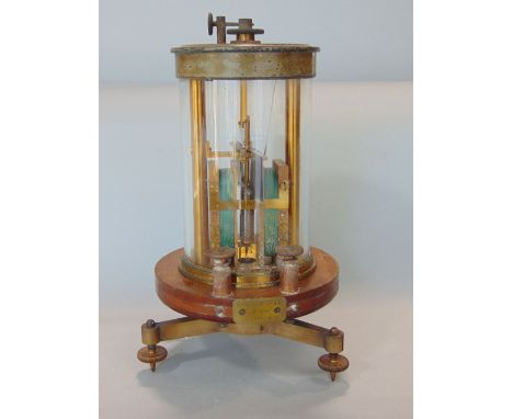 A Victorian torsion galvanometer by Siemen Bros no 5896, the brass and cylindrical glass framework set on a mahogany platform