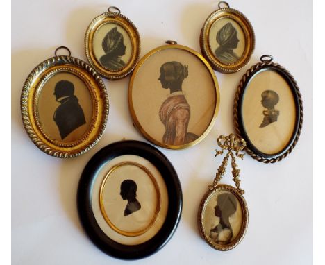 An interesting collection of early 19th century and later silhouette profile portrait miniatures including two showing a lady