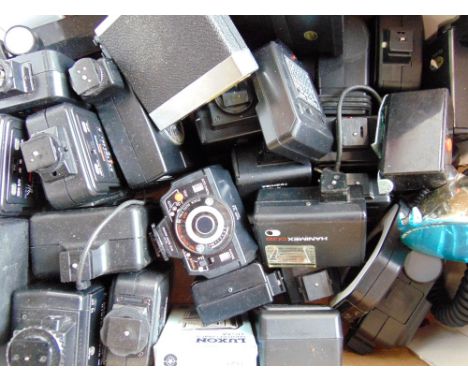 Three boxes of camera accessories to include winders, motor drives, flash units, various cables and battery chargers