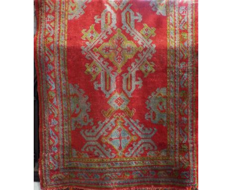 Turkish full pile runner, decorated with various green medallions upon a red ground, 400 x 120cm; together with a further Tur