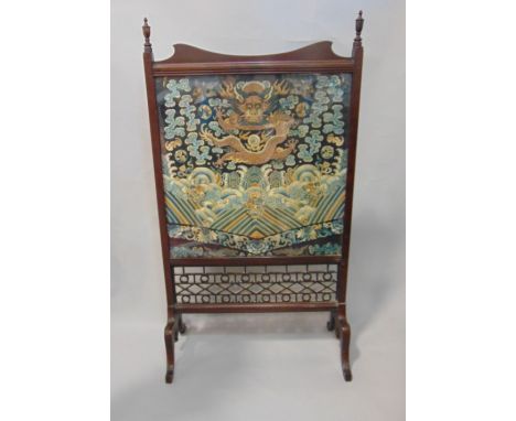 Edwardian mahogany firescreen with glazed fabric panel containing a remnant of a 19th century Chinese embroidered robe, featu