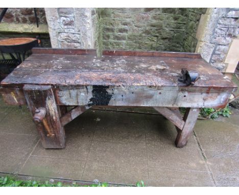 A vintage rustic pine workshop bench, with thick planked top and original wooden screw vice, approx 200cm long x 68cm wide (e