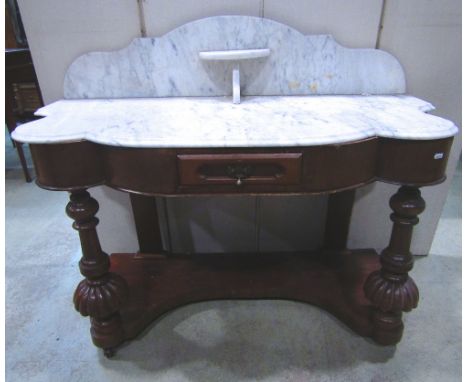 A Victorian mahogany veneered Duchess washstand with white and grey flecked shaped marble top and splashback over a frieze dr