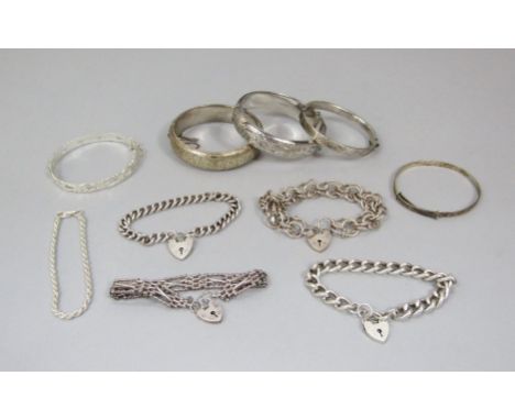 Mixed lot of silver bracelets / bangles comprising a cast hinged bangle of scrolled design - maker B Ltd, three further examp