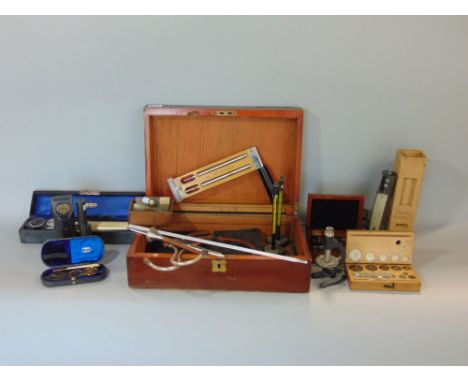 A mahogany box containing a collection of scientific instruments and thermometers, scientific scale set, various other instru