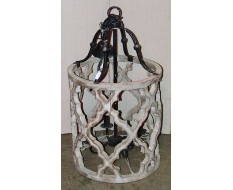 A large contemporary Gothic style hanging lantern, the cylindrical open painted and distressed wooden frame with Gothic trace