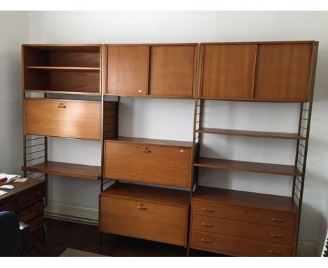 A Ladderax sectional modular adjustable shelving unit comprising a three drawer chest, three cupboards with fall fronts, two 