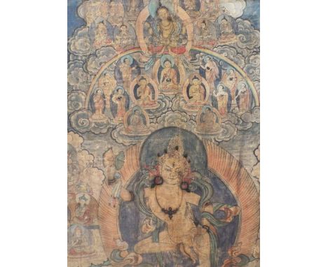 An early 19th century Tibetan Thanka showing a central dancing deity surrounded by a host of further characters amongst cloud