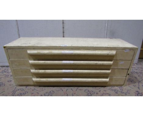 A vintage painted wooden nest of four long shallow drawers with segmented interior and moulded handles 