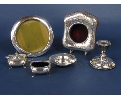 A mixed collection of silver to include a circular silver applied tondo easel frame, a planished silver pocket watch case, tw