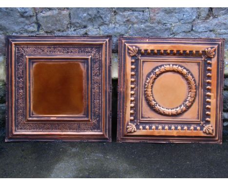 23 architectural coppered tin square moulded panels with hammered detail, 62.5cm square, together with seven further examples