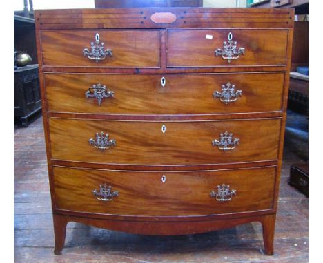 A Regency mahogany bow fronted chest of three long and two short drawers with caddy top and raised on swept supports, with ca