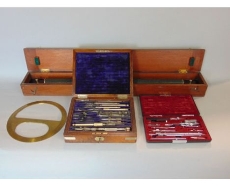 Burr walnut case box containing a collection of engineers stationery tools, together with a further similar box set, a desk r