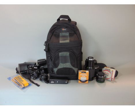 A box containing a collection of good quality camera equipment to include a Ricoh camera, Canon camera, various Ricoh and oth