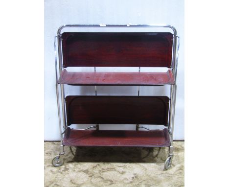 A Gerlinol Dinette three tier folding tea trolley, the tubular steel frame with laminated shelves, together with an oak stool