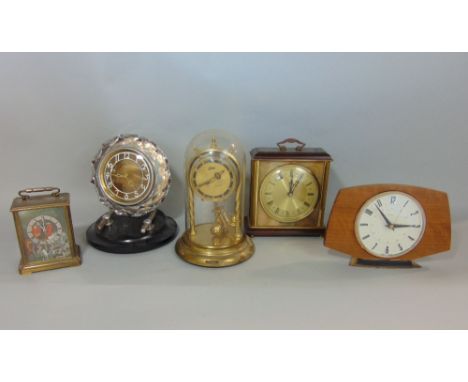 A collection of various vintage retro mantle clocks to include a Majak lucite case mantle clock, a Metamec vintage clock, a c