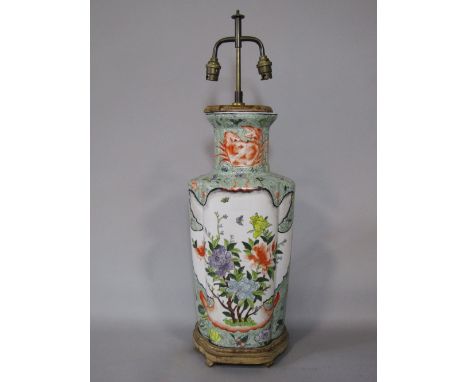 A large oriental lamp base of lobed form with polychrome painted decoration incorporating flowers, figures, crabs, insects, e