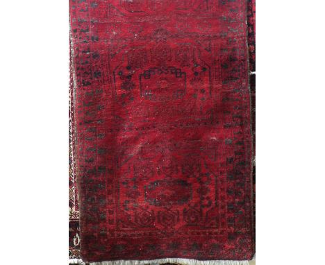 A red ground Afghan runner with geometric detail within repeating borders of unusual size, 380 long x 100 cm width