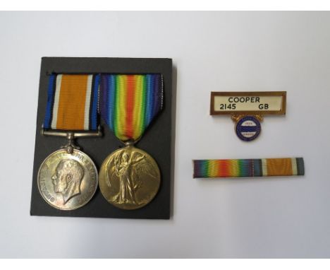 A WWI pair of medals to 2569 A. CPL. C.S.B. COOPER NORF. R. together with ribbon bar and ID badge for IWS Congress